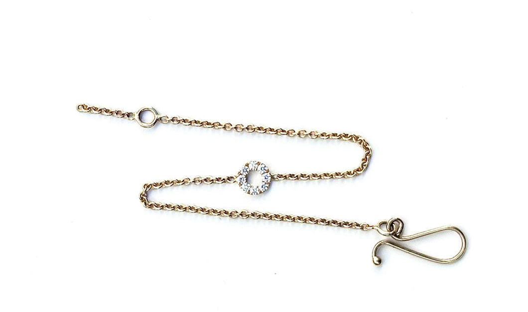 Armbånd i 14 karat guld, med halo af TW brillianter